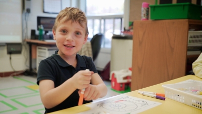 a boy is drawing