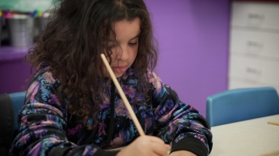 a girl is writing